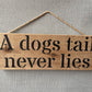 Handmade wooden sign - (A dogs tail never lies)