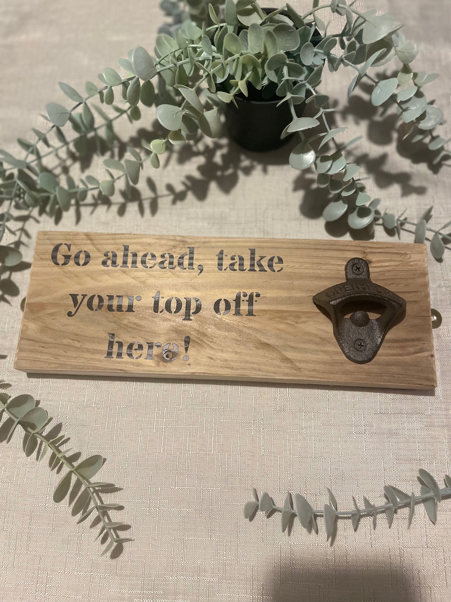 Rustic hardwearing wooden beer bottle opener - Go ahead, take your top off here!