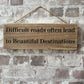 Handmade wooden sign (Difficult roads often lead to beautiful destinations)