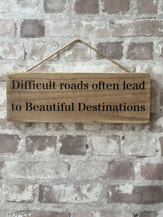 Handmade wooden sign (Difficult roads often lead to beautiful destinations)