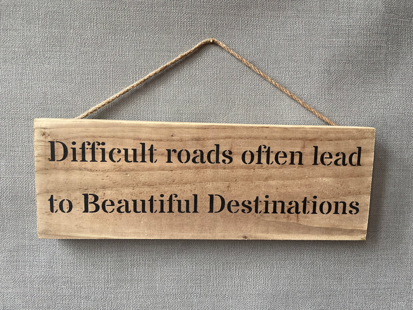 Handmade wooden sign (Difficult roads often lead to beautiful destinations)