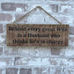 Handmade wooden sign - Behind every great Wife is a Husband who thinks he's in charge