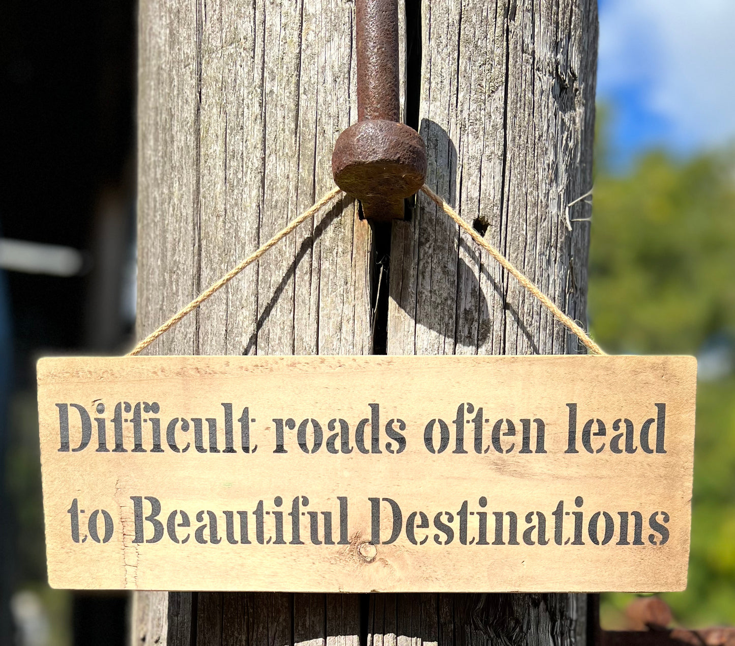 Handmade wooden sign (Difficult roads often lead to beautiful destinations)