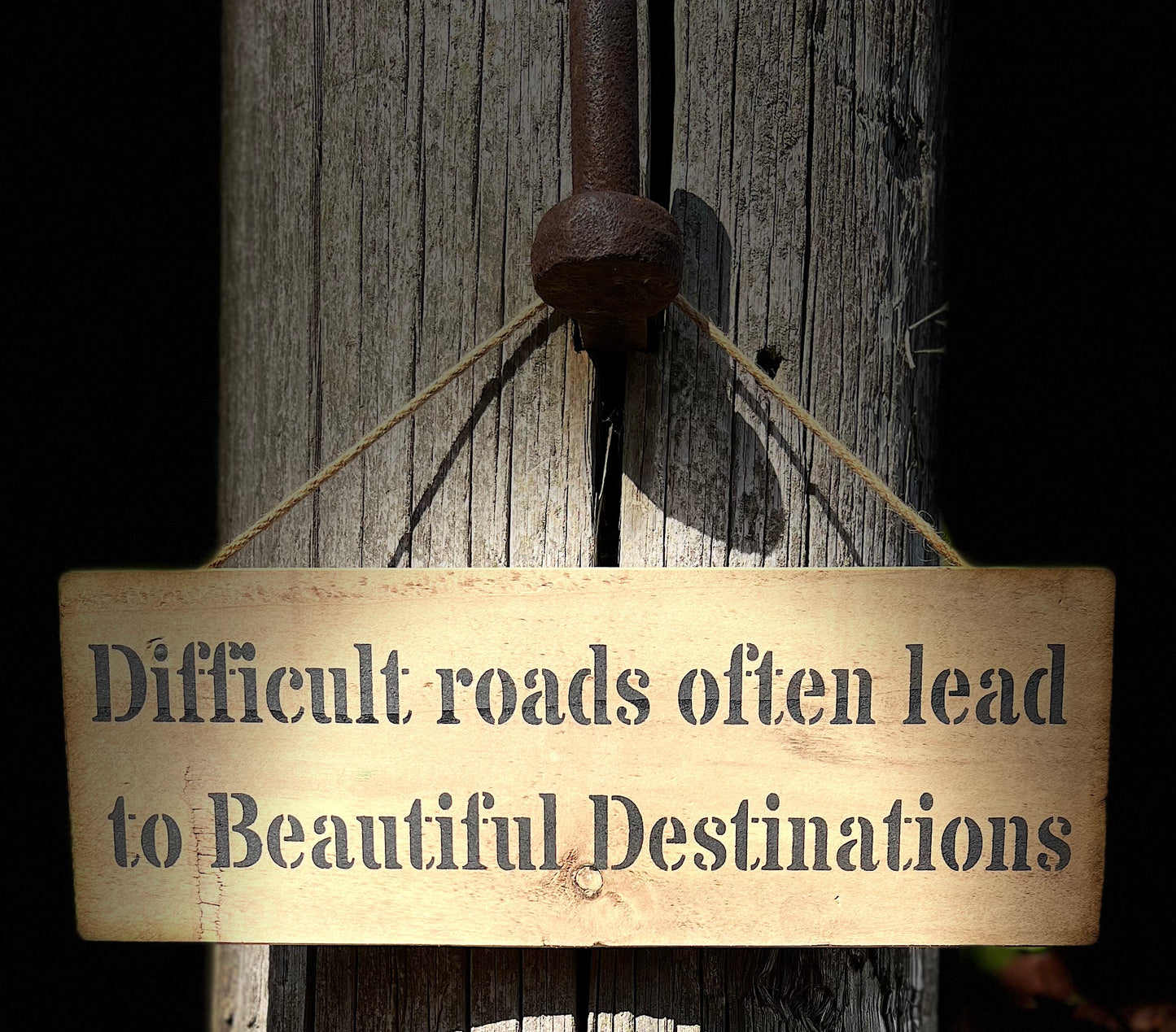 Handmade wooden sign (Difficult roads often lead to beautiful destinations)