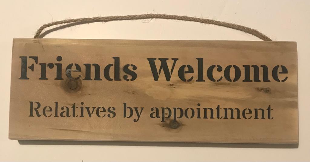 Handmade wooden sign - (Friends Welcome Relatives by appointment)